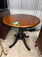 Full view of café table showing two-tone finish