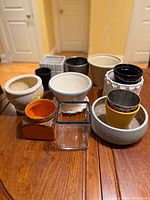 Group shot of all ceramic pots and glass vase