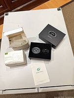 Full lot showing Snore Circle boxed unit, open accessory box, spare pads and manual