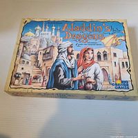 Front of Aladdin's Dragons game box showing title and artwork
