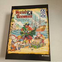 Front of Buried Treasure game box showing pirate artwork and FX Schmid logo