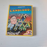 Front of Landlord! game box showing title, designer name, publisher logo