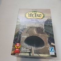 Front of Metro Paris 1898 game box showing artwork and branding