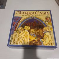 Closed box front displaying MarraCash artwork and branding
