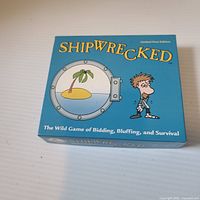 Top of closed Shipwrecked box showing title and artwork