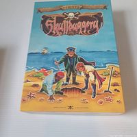 Front of Skullduggery game box showing title and artwork