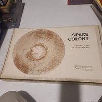 Box top showing title Space Colony and Teaching Aid Co. logo