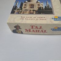 Front corner of Taj Mahal box showing title, Taj Mahal image, Rio Grande Games logo