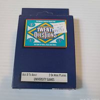Front of Twenty Questions game box with title logo and age/player information