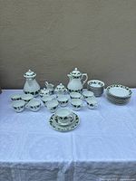 Full 48-piece Ivy pattern coffee service displayed on table