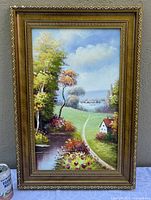 Full view of framed pastoral landscape painting