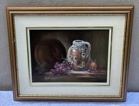 Frontal view of framed still life painting