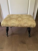 Top view of footstool showing upholstery pattern