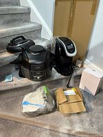 Ninja Foodi, Keurig brewer, silicone set, boxes on stairs