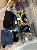 All eight garments laid out on stairs