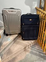 Both suitcases side by side on stairs