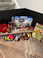 Full lot showing boxed Paw Patrol playset, Power Rangers figure, Yoga Cards, sports toys and novelties
