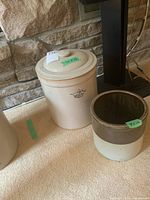 Both crocks side by side showing size comparison and lid