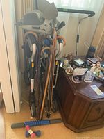 Group view of walker, canes, boot, weights, rail and grabbers