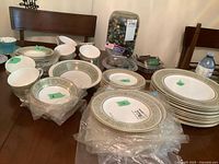 Overview of stacked dinnerware pieces on table