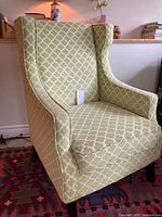 Full view of green geometric wingback armchair