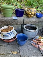 Group shot of assorted pots, saucers and packaged pot feet