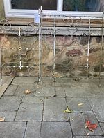 Both aluminum scrollwork panels side by side