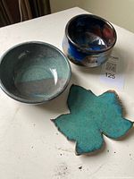Overview of two bowls and leaf dish on table