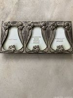 Front view showing Glasgow Rose silver triple frame and text inserts