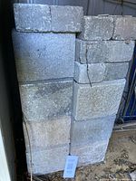 Stack of manufactured stone blocks showing quantity and size mix