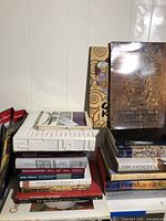 Overall lot showing stacked art and architecture books