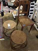 Group shot of oak chair and two rattan cane stools