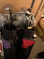 Two filled golf bags side by side