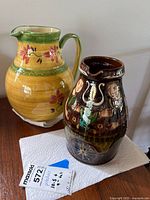 Both pitchers side by side with lot tag