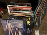 Front view of stack of LPs showing multiple album covers including Ringo Starr and Wings titles