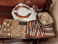 Overview showing chargers, tray, napkin rings and flatware