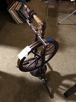 Full view of spinning wheel showing overall structure and attached fiber