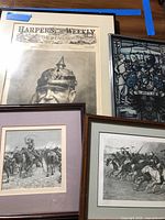 Group shot of all four framed pieces showing relative sizes and subjects