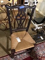 Full view of wood chair with rush seat