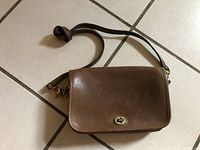 Front view showing flap, turn-lock and strap