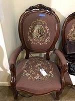 Front full view of chair showing upholstery and wood frame