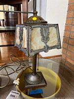 Full view of slag glass lamp showing shade, base, cord, height indicator