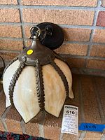 Full view of slag glass pendant light on brick hearth