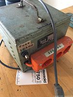 Full view showing transformer box with handle, 220 VAC outlet and 10 A fuse