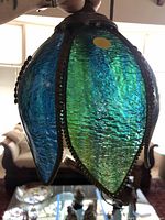 Full view of pendant light showing colored glass panels