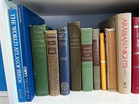 Books on birds, cytology, evolution, Arabian nights, with various colors and conditions