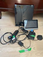 Photo showing RCA Amplified Indoor Flat HDTV Antenna, La Crosse Technology Weather Station display, WD My Passport Ultra hard drive, and Sony AN-71 Compact Antenna with cables.