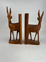 Front view of both wooden gazelle bookends