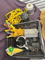 Overall lot showing cookware, coffee pots, rope, stakes in plastic crate