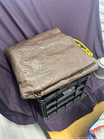 Folded brown tarp on crate